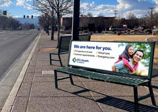 Photograph of Grand Valley Transit bus bench with advertising poster for SCI Health.