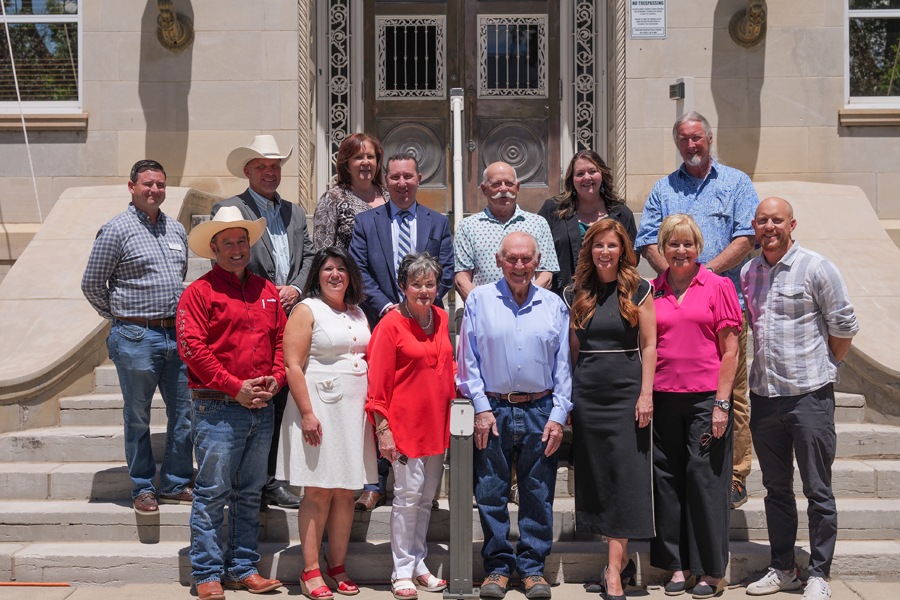 Current and former Mesa County elected officials and community leaders pose for a group photo on the steps of the Old Mesa County Courthouse in downtown Grand Junction during the America 250 Celebration commemorating the 250th anniversary of the signing of the Declaration of Independence.